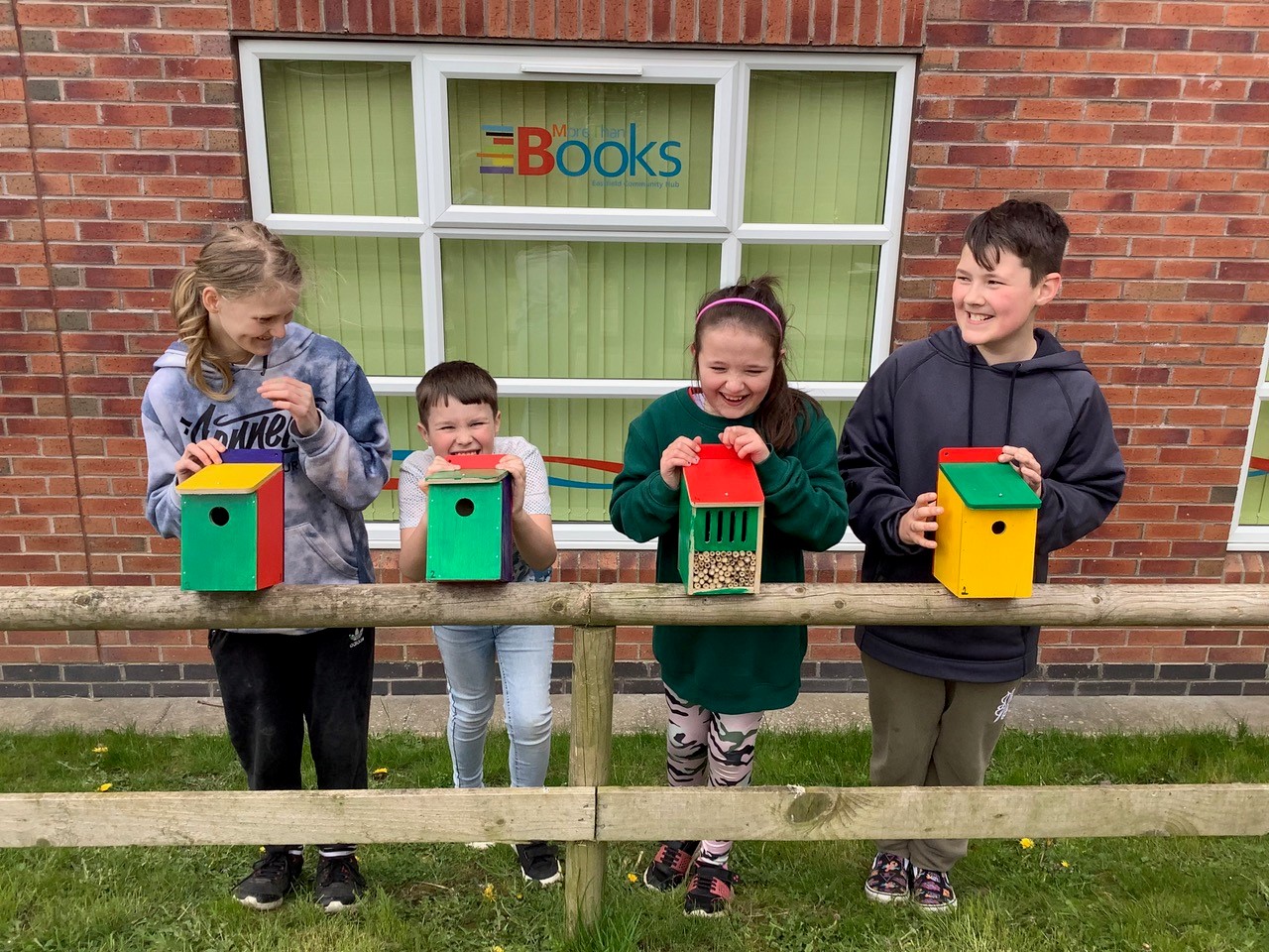 Four children with bird boxes