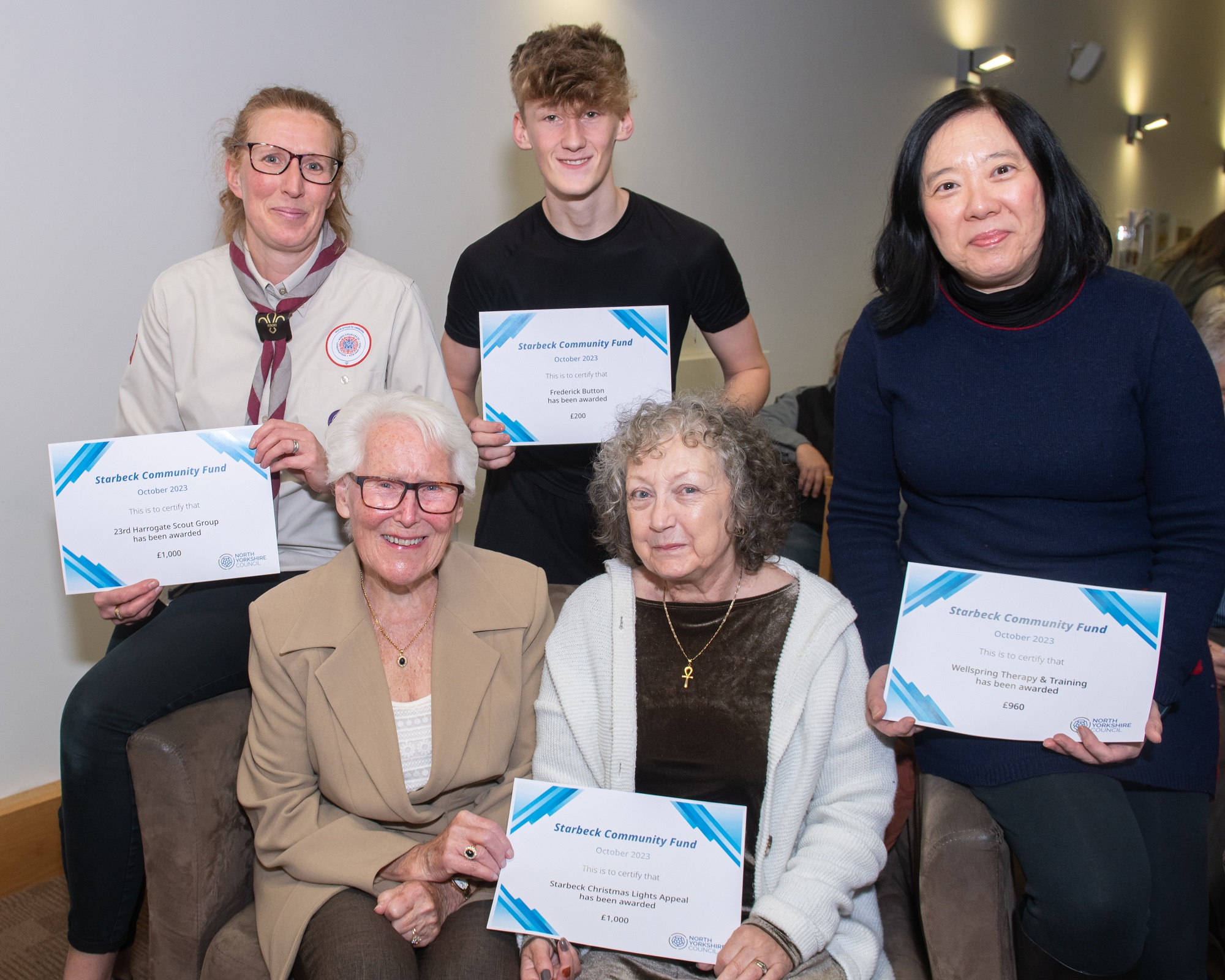 Cllr Pat Marsh, seated bottom left, with some of the Starbeck grants recipients, clockwise, from top, Sharon Bryant, assistant leader of the 23rd Harrogate Scout Group’s Cubs section, Frederick Button, one of the individuals to receive a grant, Kennie Cheung, of Wellspring Therapy and Training, and Chrissie Holmes, of Starbeck Christmas Lights Appeal.