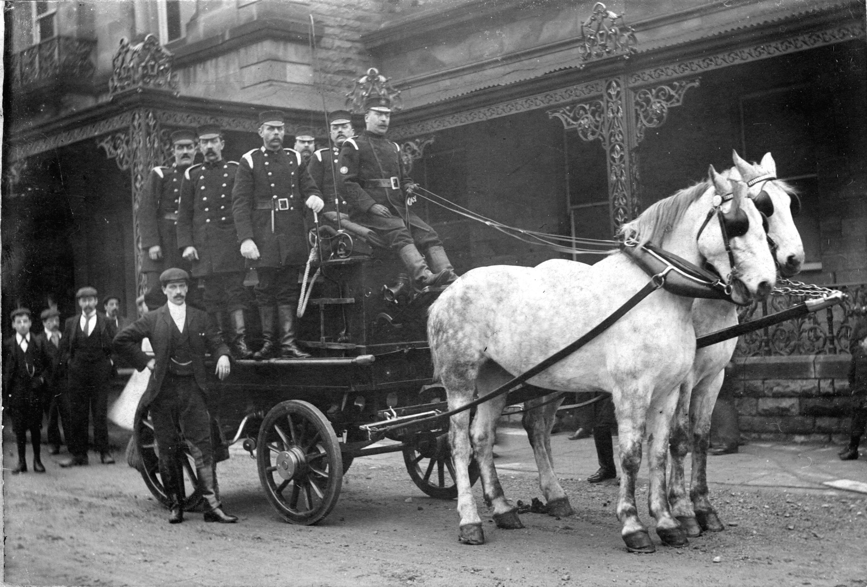 An early fire engine and crew outside Victoria Baths. Captain Allen is in charge of the crew.