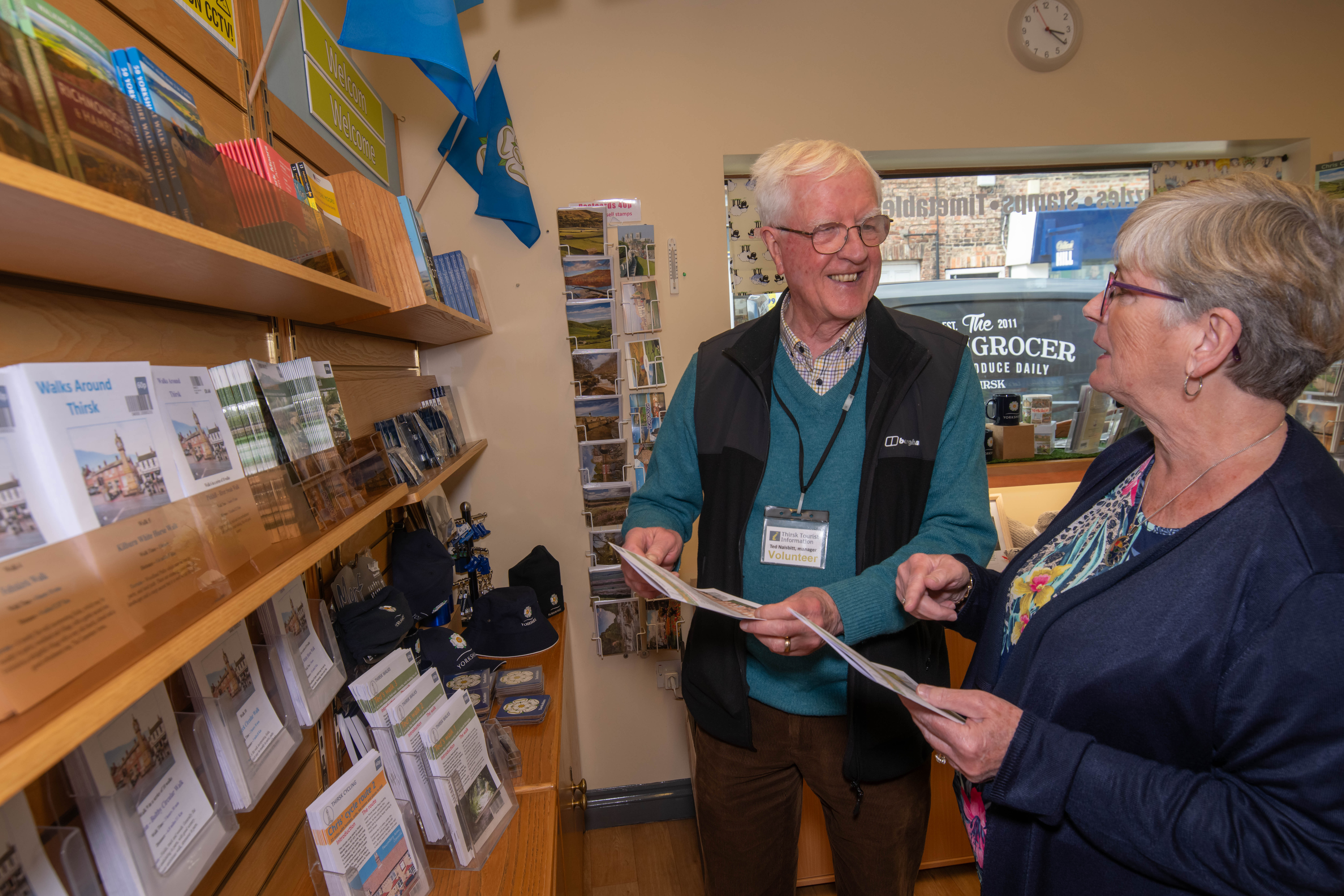 Two people in Thirsk Tourist Information Centre