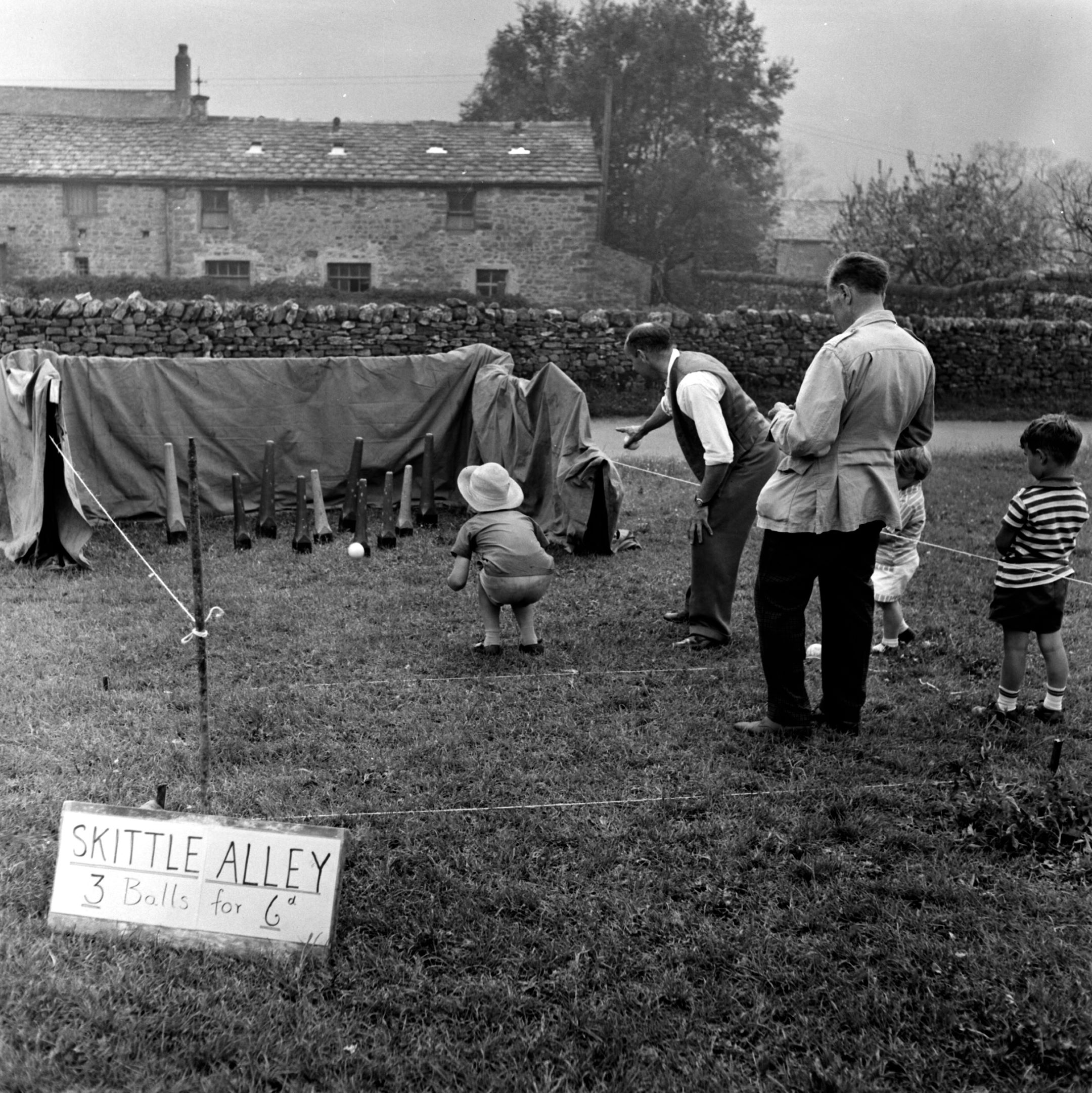 Playing skittles at Buckden village fair. From the Bertram Unné photographic collection. 