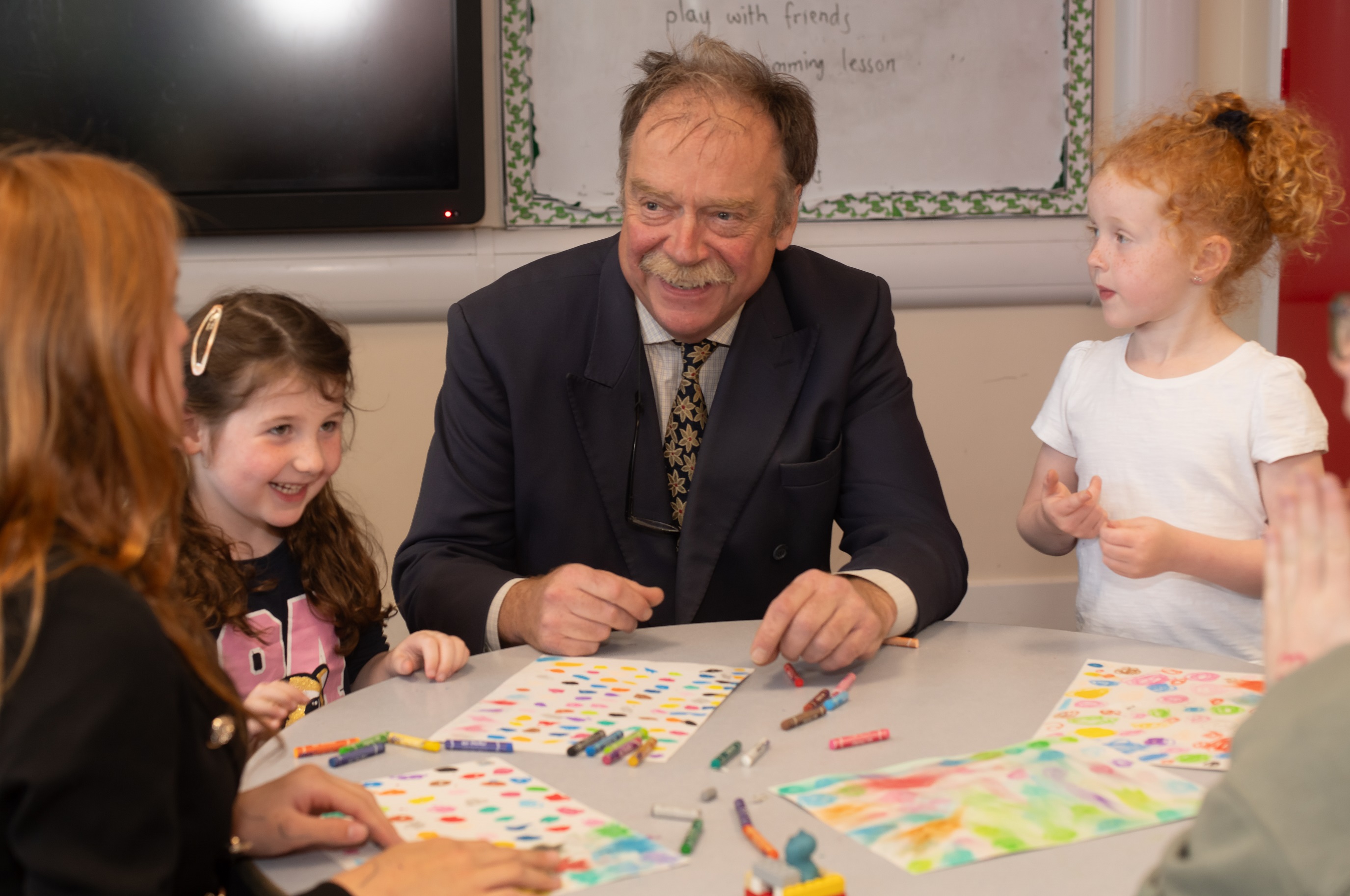 Cllr Kevin Foster lends a hand to designs for the hoardings.