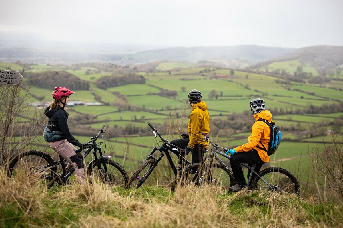 Three people on bikes