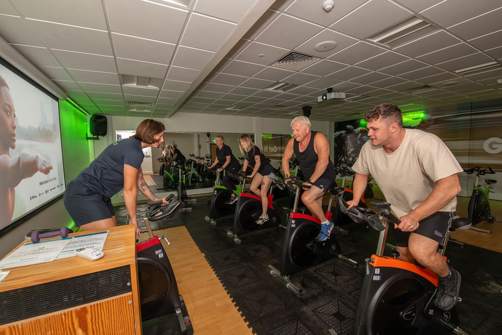 A group of customers enjoying a spin class