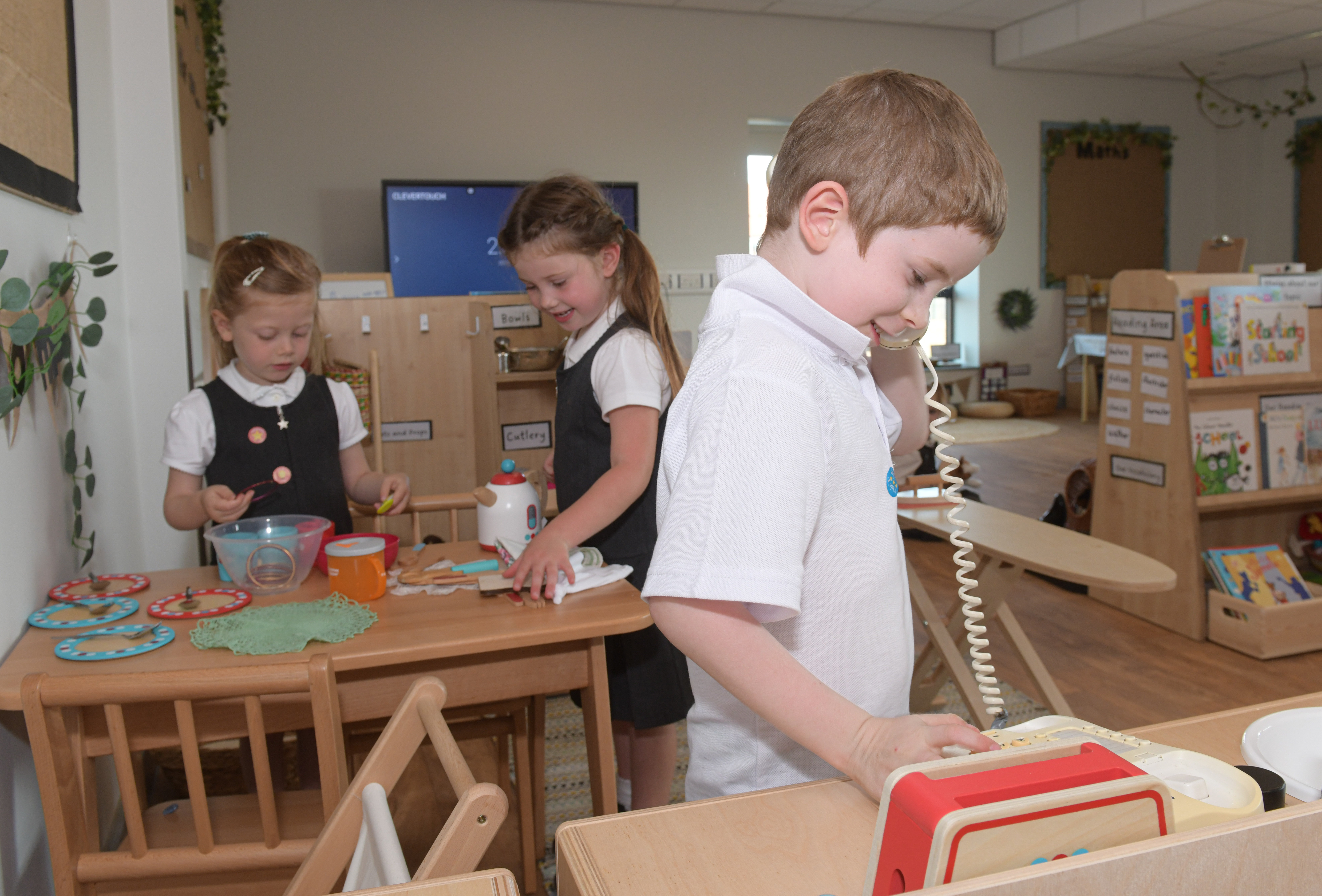 Three children in their new school