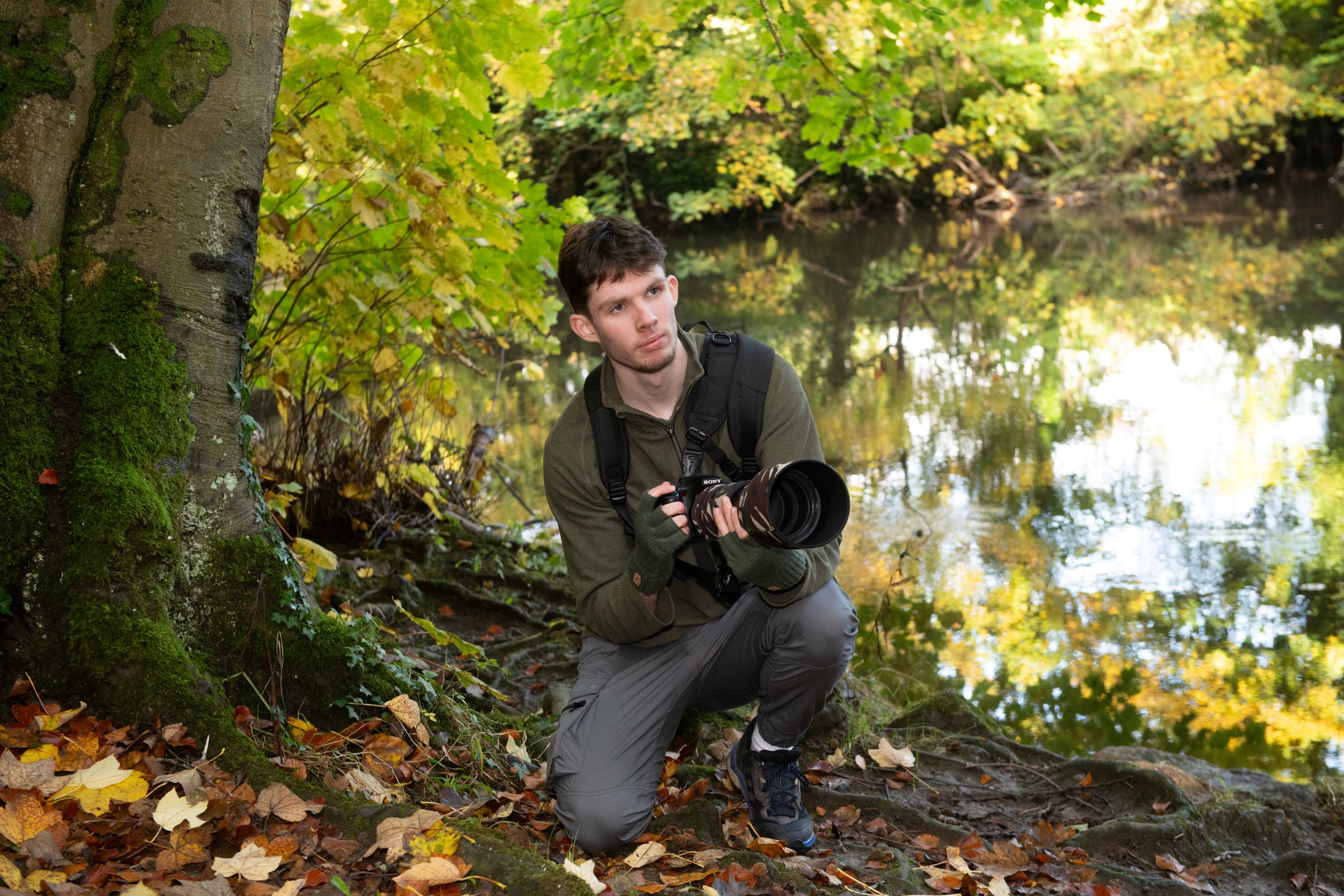 Liam Pinchen photographing wildlife in woodland at Conyngham Hall, Knaresborough. Liam received £200 from the Starbeck Community Fund to help towards a website to display his wildlife photos.