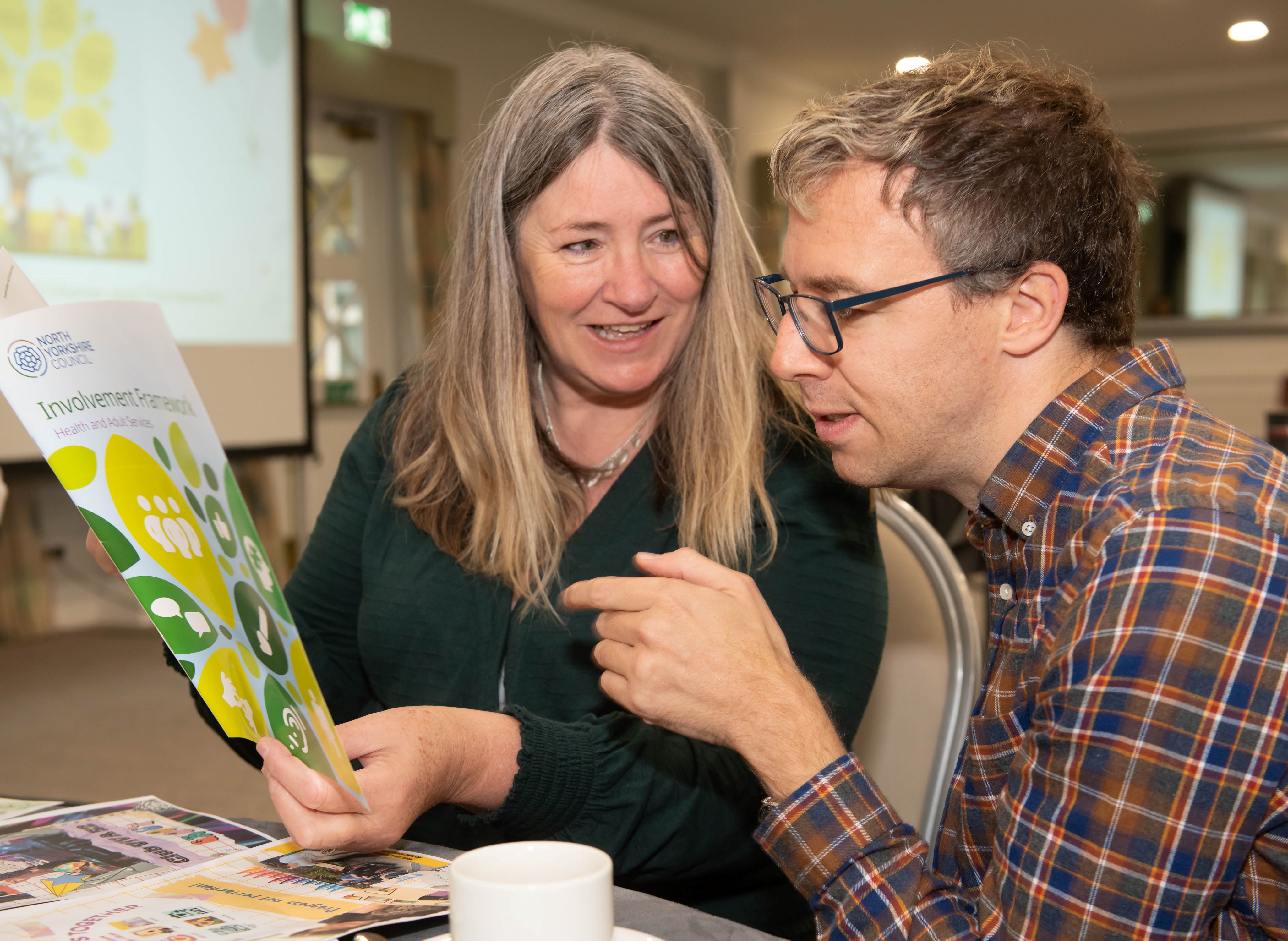 Katie Peacock, independent co-chair of the North Yorkshire Learning Disability Partnership Board, with Christopher Porter, self-advocate chair of the North Yorkshire Health and Wellbeing Group, looking at the newly-launched charter and framework.