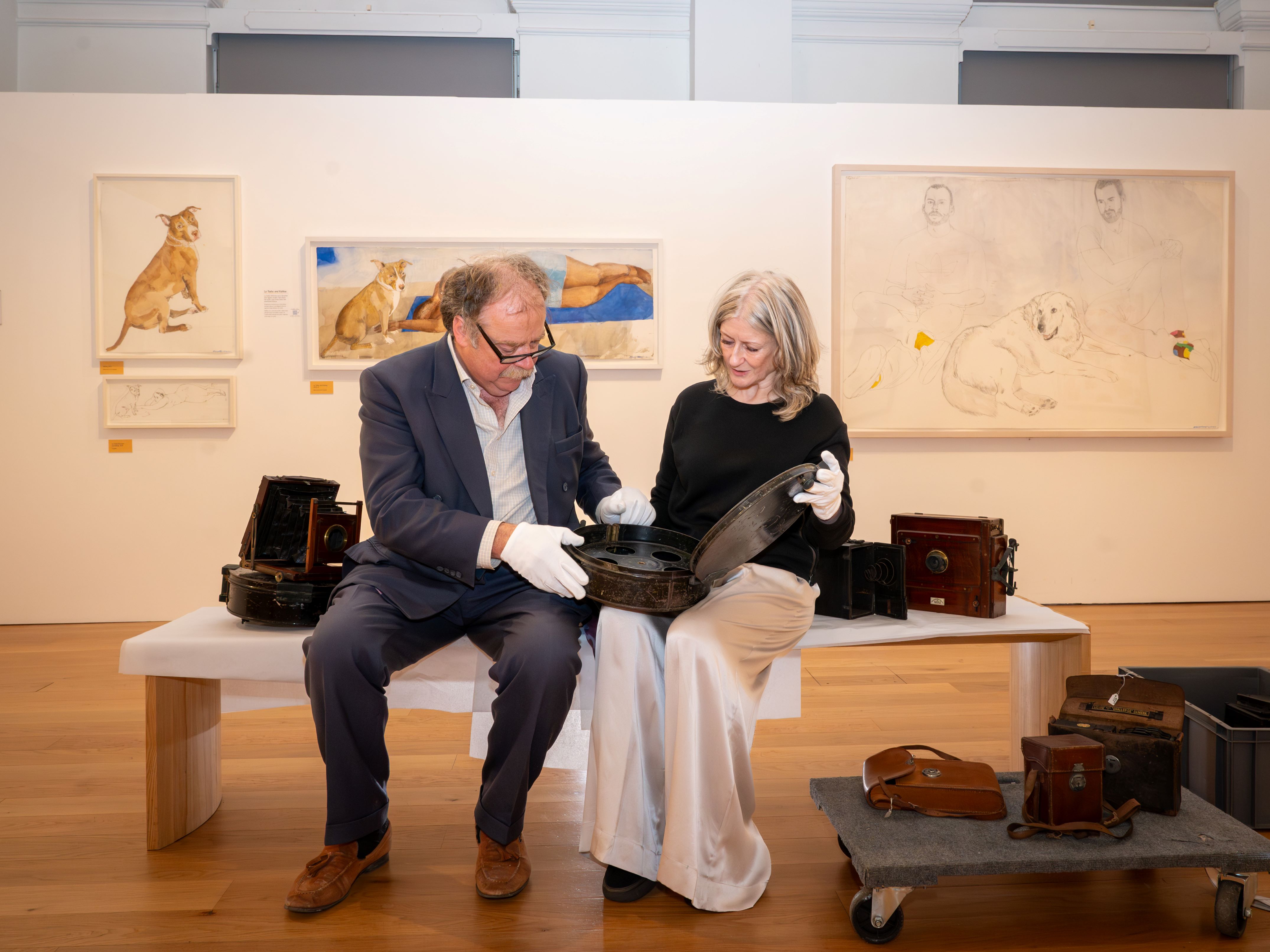 North Yorkshire Council’s executive member for culture, Cllr Simon Myers, checks out exhibits at the Mercer Gallery in Harrogate with exhibitions curator, Karen Southworth.