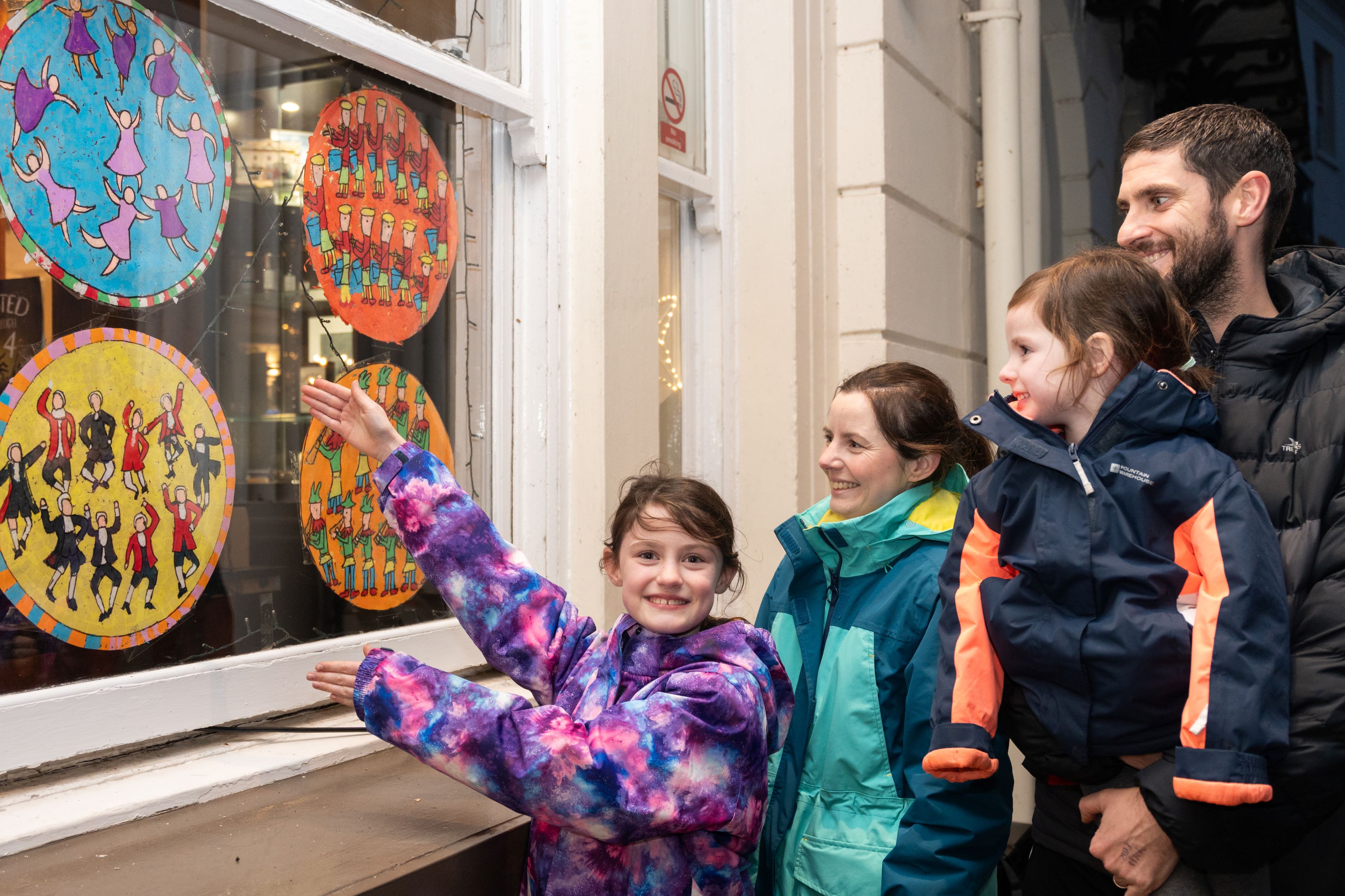 People looking in a window at Scarborough Lights