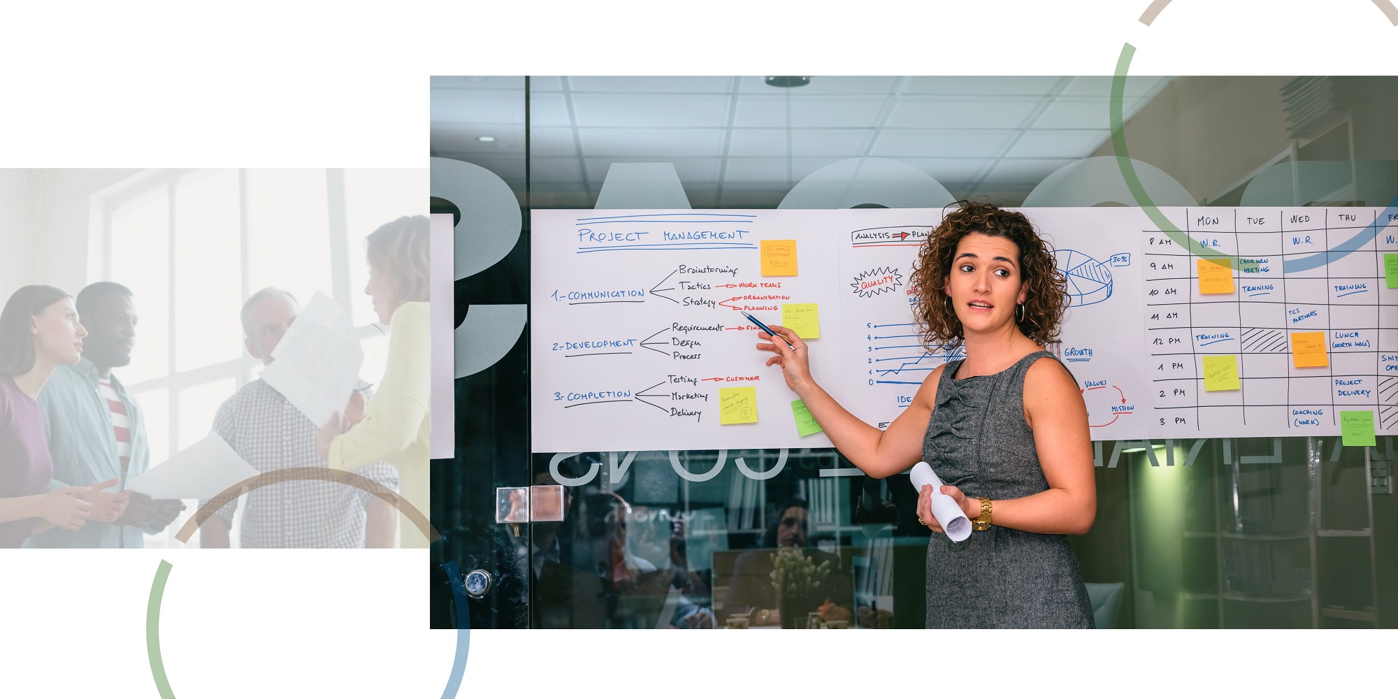 Woman presenting to a team, pointing to a board with information on project management.