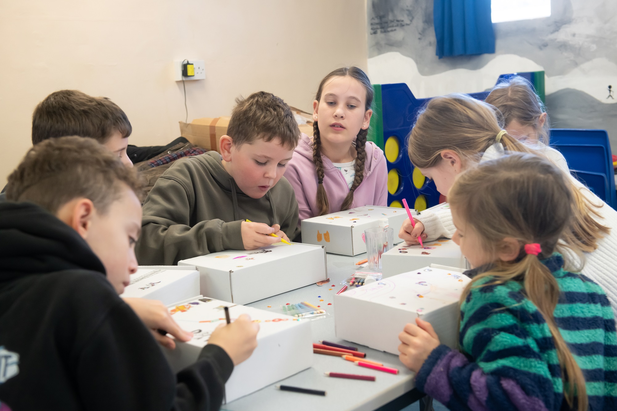 Students colouring boxes