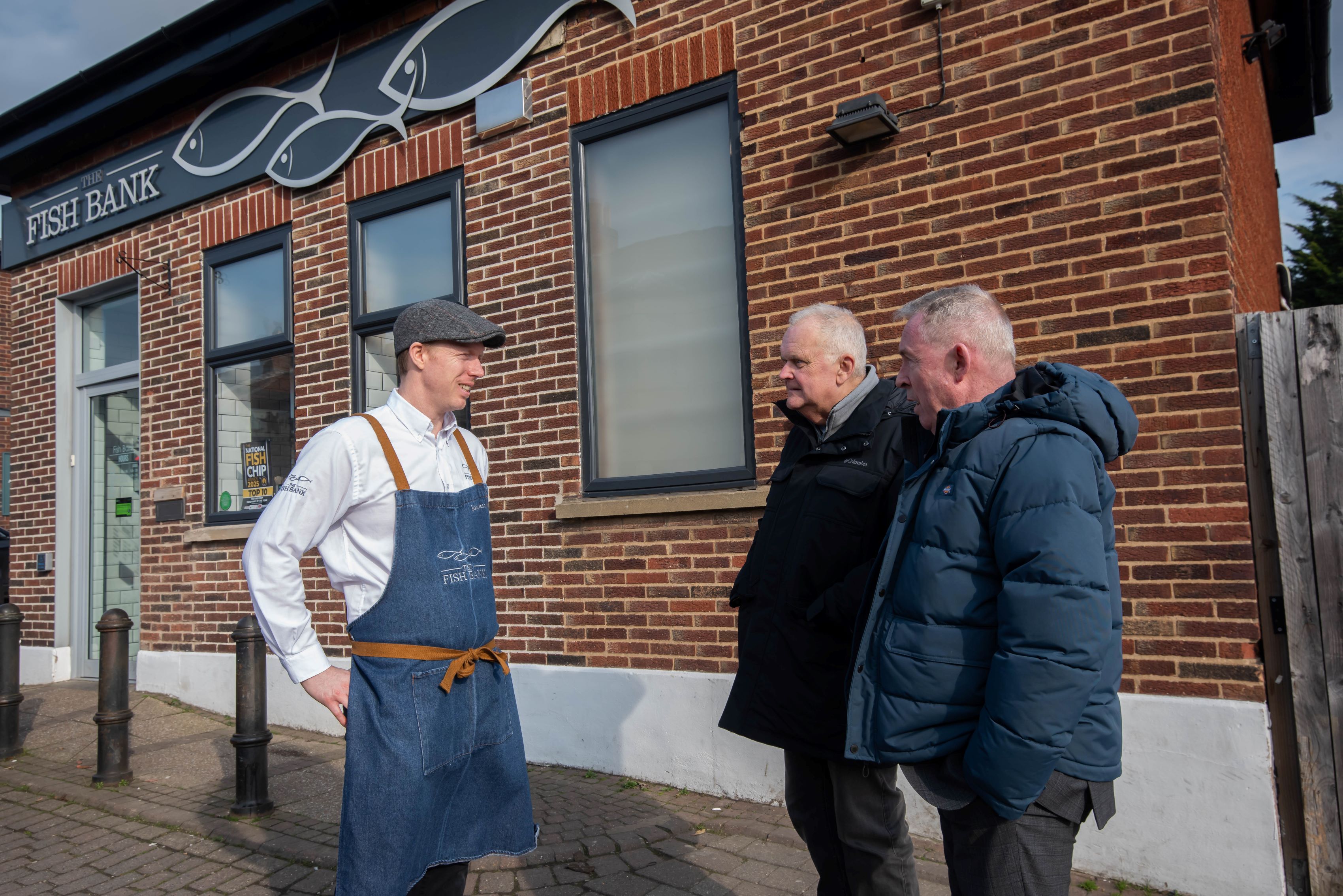 From left, owner of The Fish Bank Jonathan France with Cllr Bob Packham and Cllr Mark Crane