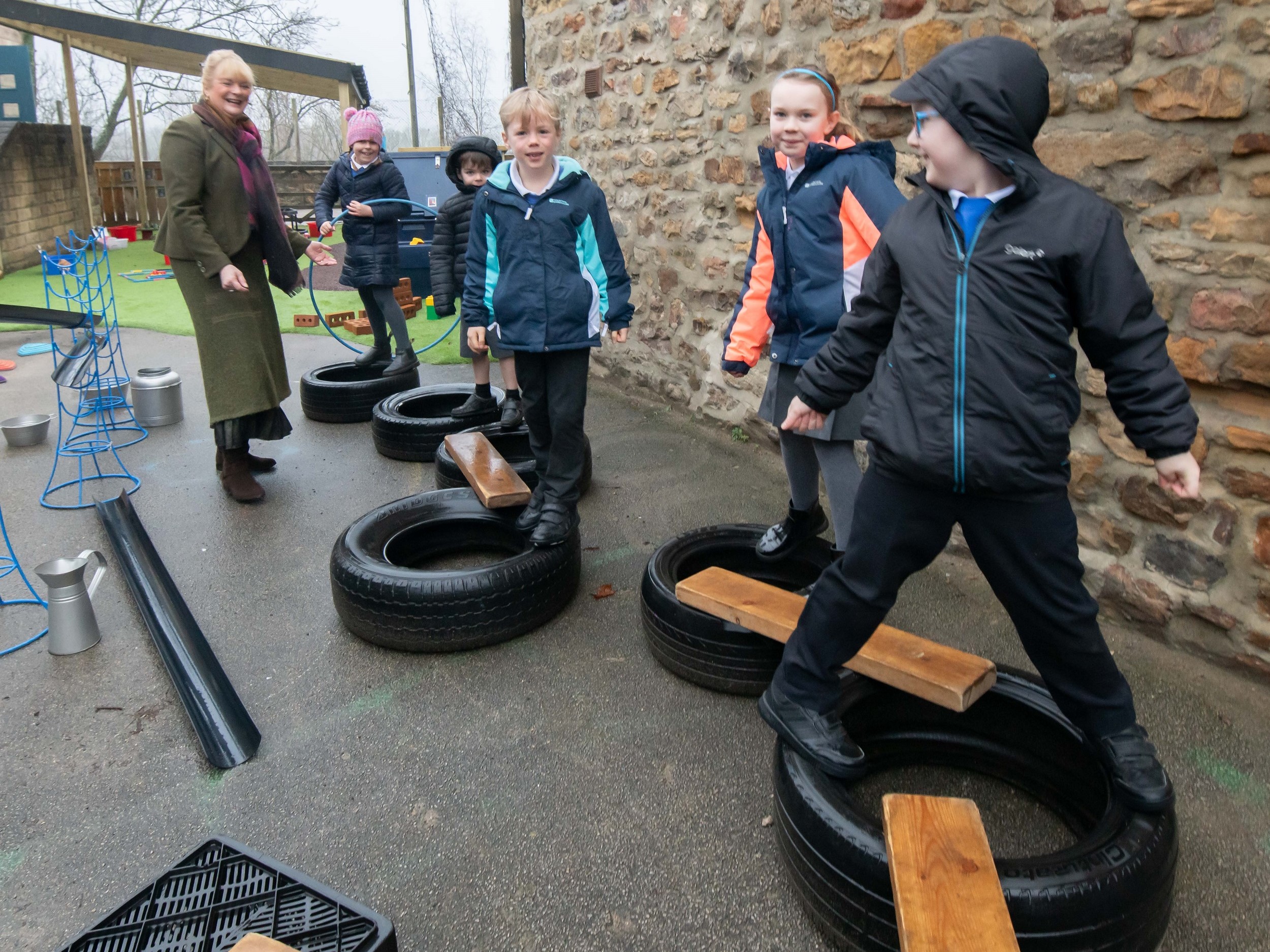 The playground for children in Reception and Year 1 at Masham Church of England Voluntary Aided Primary School, has undergone a revamp replacing an “old and tired” area into a new and exciting space for the youngsters to enjoy. Also pictured is Cllr Annabel Wilkinson.