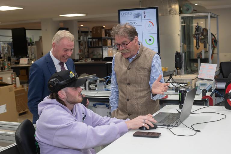 Apprentices Louis Thomas and Lewis Gustard with North Yorkshire Council’s chief executive, Richard Flinton