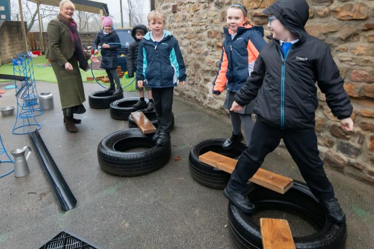 The playground for children in Reception and Year 1 at Masham Church of England Voluntary Aided Primary School, has undergone a revamp replacing an “old and tired” area into a new and exciting space for the youngsters to enjoy. Also pictured is Cllr Annabel Wilkinson.