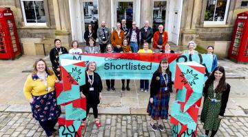 The Skipton Town Hall team, including staff and volunteers, celebrates Craven Museum's selection as a finalist for Art Fund’s Museum of the Year 2024