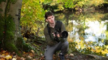 Liam Pinchen photographing wildlife in woodland at Conyngham Hall, Knaresborough. Liam received £200 from the Starbeck Community Fund to help towards a website to display his wildlife photos.