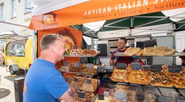  A customer and stallholder sharing in the fantastic atmosphere when Filey Food and Drink Festival was held earlier this year.