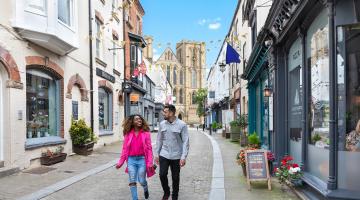 A couple walk through the streets of Ripon. The North Yorkshire city and the county’s towns are seen as key to helping to develop the visitor economy. (Picture credit: Charlotte Gale.)