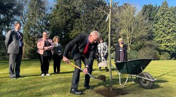 North Yorkshire Council’s chief executive, Richard Flinton, centre, at the tree-planting ceremony. Left to right in the background are Dr James Dunbar, a consultant in infection and general medicine at the Friarage Hospital in Northallerton, staff nurse Helen Sharpe, the council’s public health manager, Emma Davis, reablement care and support worker Julie Samways, and the chief executive officer for the South Tees Hospitals NHS Foundation Trust, Stacey Hunter.