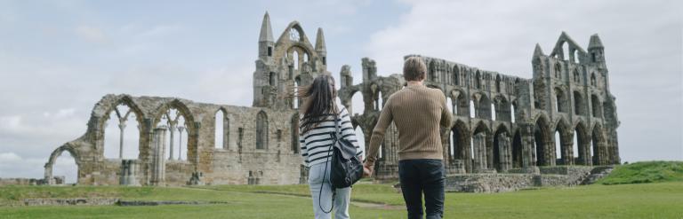 Two people at Whitby Abbey