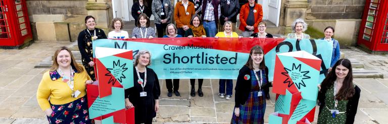 The Skipton Town Hall team, including staff and volunteers, celebrates Craven Museum's selection as a finalist for Art Fund’s Museum of the Year 2024. Photo credit: Stephen Garnett.