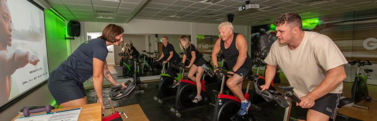 A group of customers enjoying a spin class