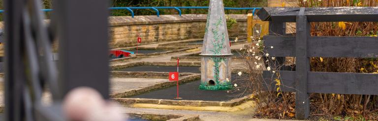 One of the holes on Richmond Leisure and Wellbeing Hub mini golf course with some golf balls in the foreground.