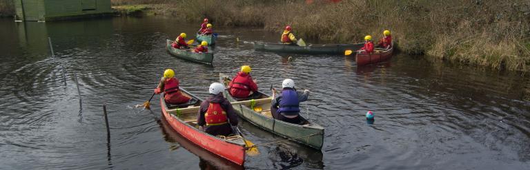 Children in canoes 